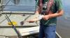 Person on a boat holding a specimen of Freshwater Drum